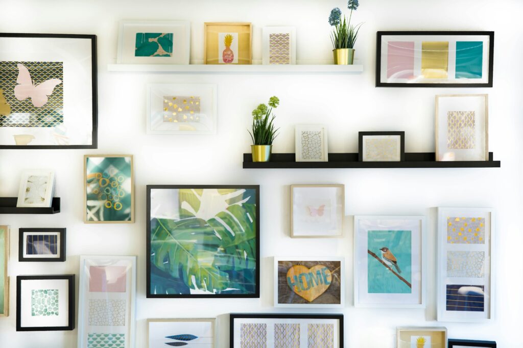 Several picture frames placed on a wall in a collage