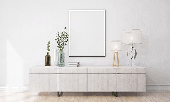 A frame on a wall above a credenza