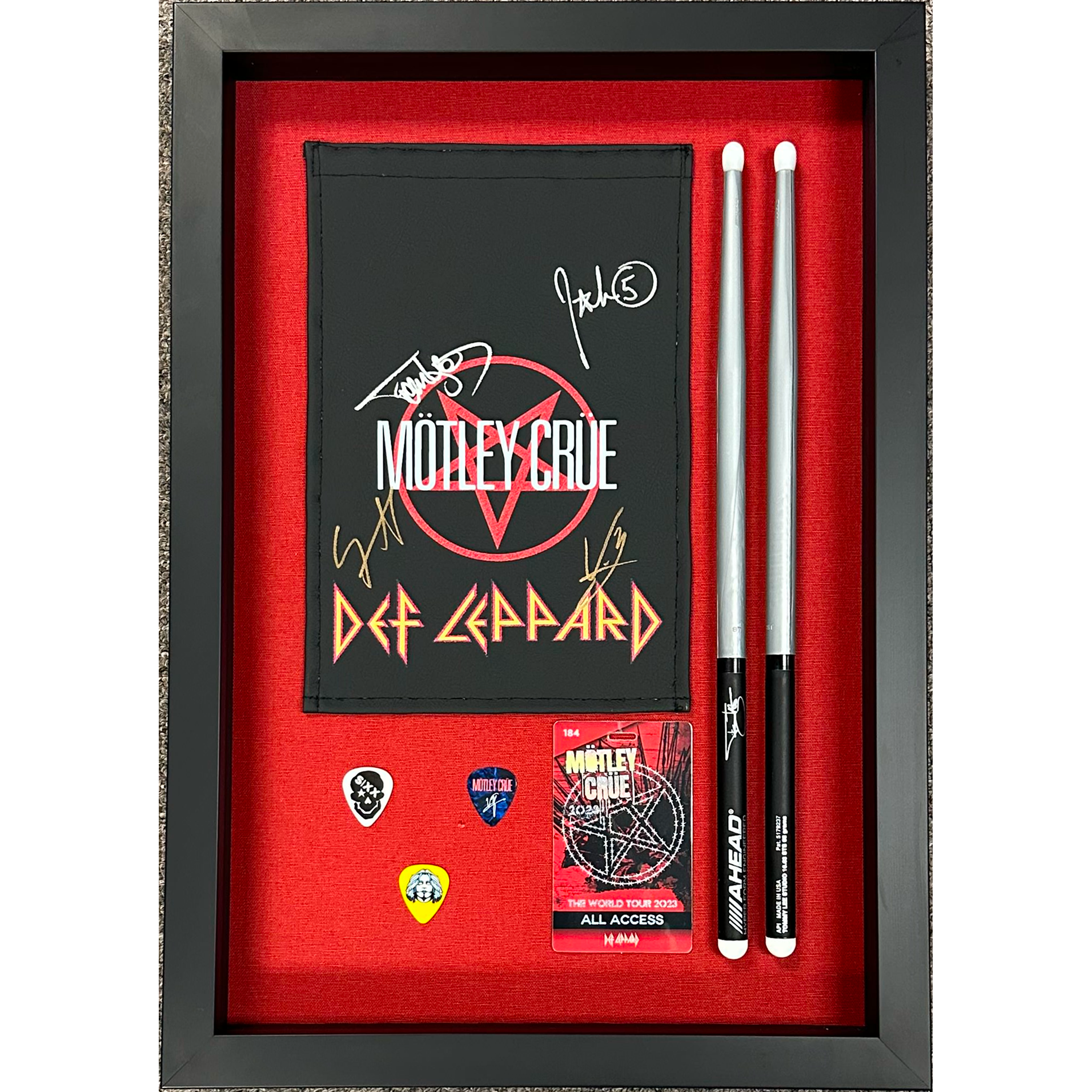A Motley Crue concert shadow box frame.