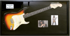 Guitar and photos in a shadow box