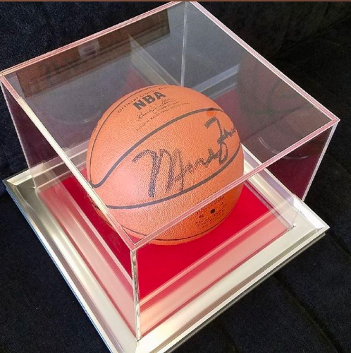 Autographed basketball in a custom shadow box.