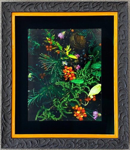 Picture of berries and flowers in a molded frame with dark mat.