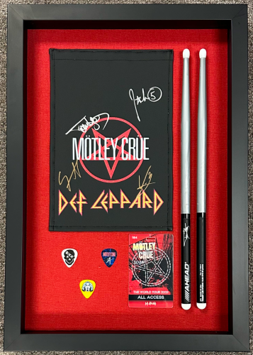 Motley Crew and Def Leppard concert memorabilia in a custom shadow box.
