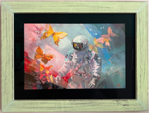 Painting of an astronaut and butterflies in a light frame with dark matting.
