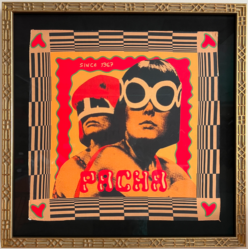 Framed pop art poster in a custom lattice frame with dark matting.