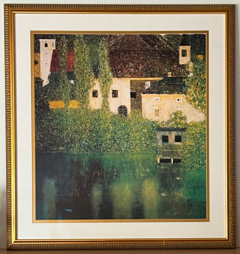 Water Castle print in a gold picture frame.