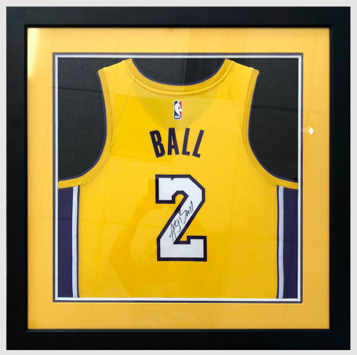 Sports memorabilia in a shadow box.